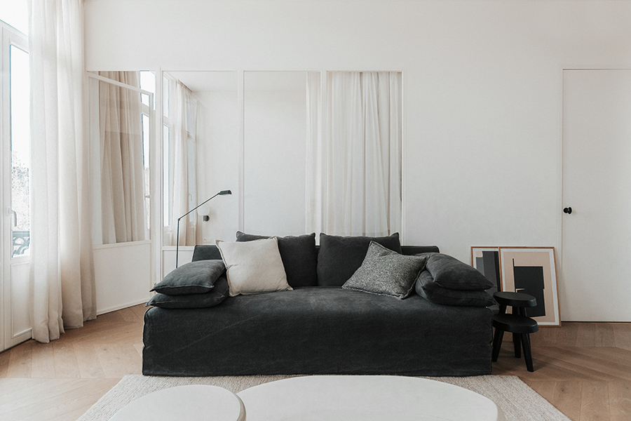 Textured Linen Sheer Drapery, Verellen: Airy, floor-length sheer linen draperies filter soft daylight into a serene, modern Bozeman living room. These textured Bozeman draperies by Verellen offer understated elegance and light-diffusing comfort for refined Montana interiors.