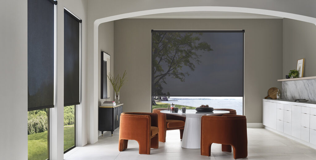 Dark screen shades in a clean-lined dining space, providing sun filtering with minimalist window shades in Bozeman.